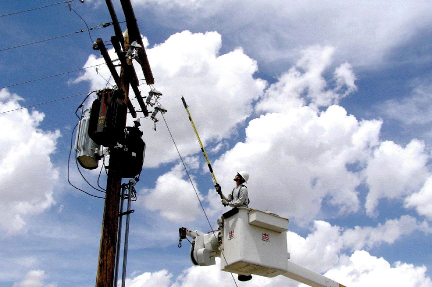Lineman in bucket with hot stick