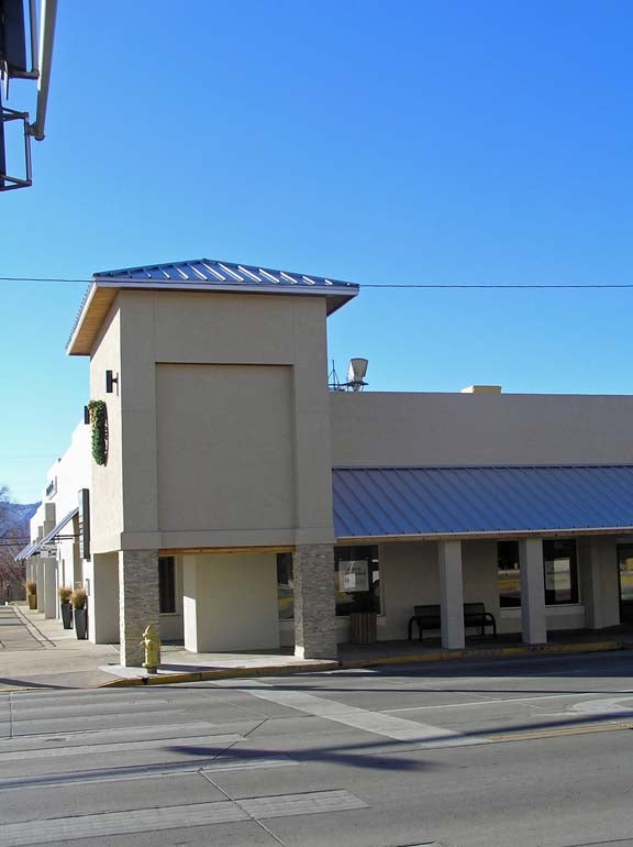 Cornr of commercial building on street in town