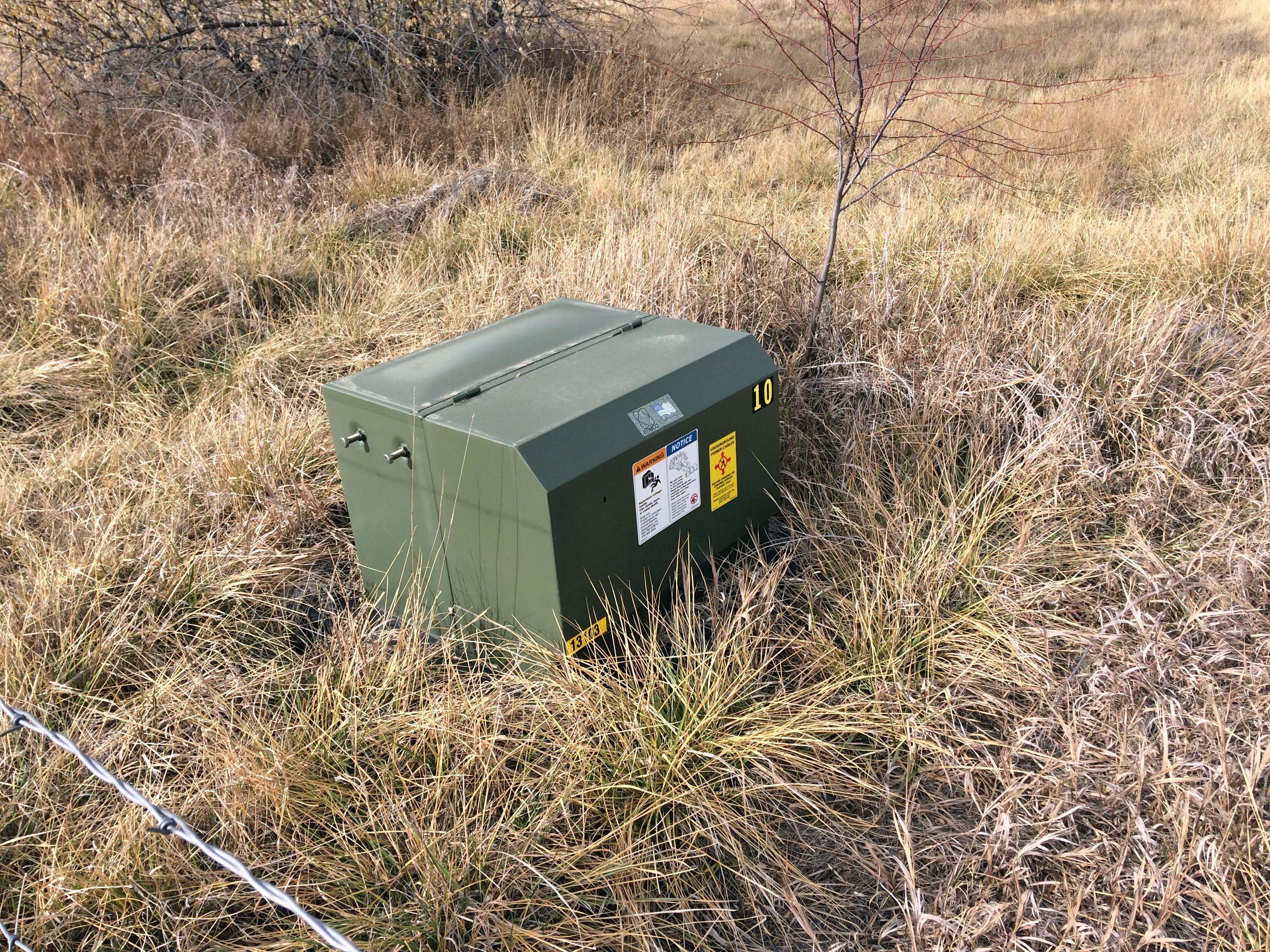 10 kVA pad mounted transformer in a field