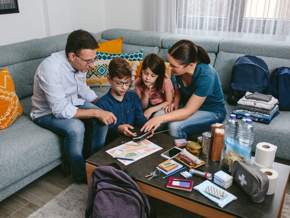 family sitting around coffee table planning for an emergency