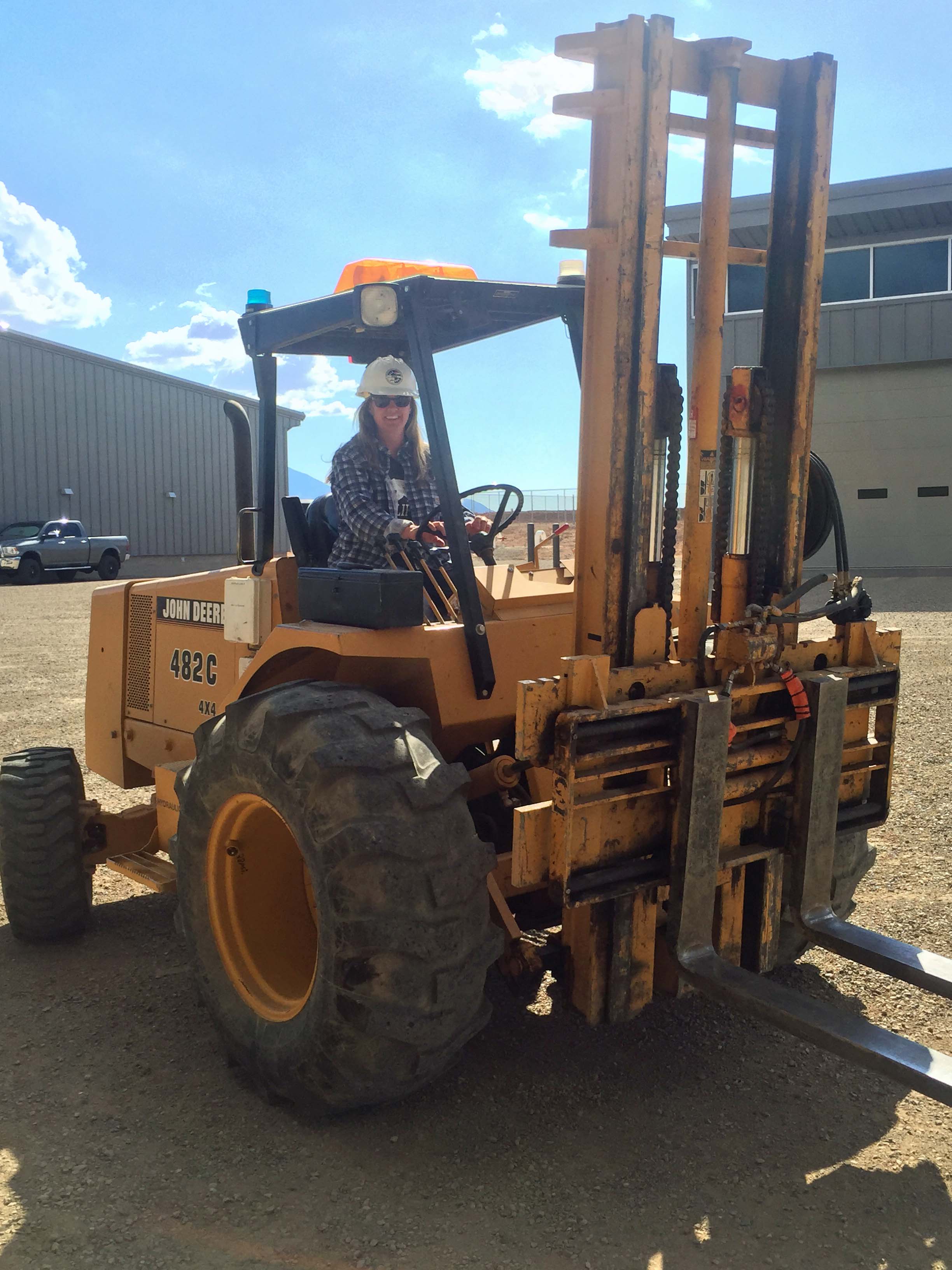 Woman operating forklift