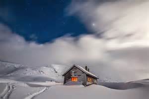 House surrounded by snow