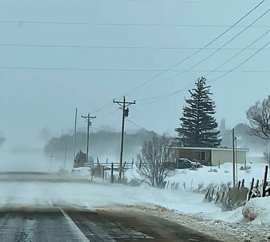 county road in snow storm